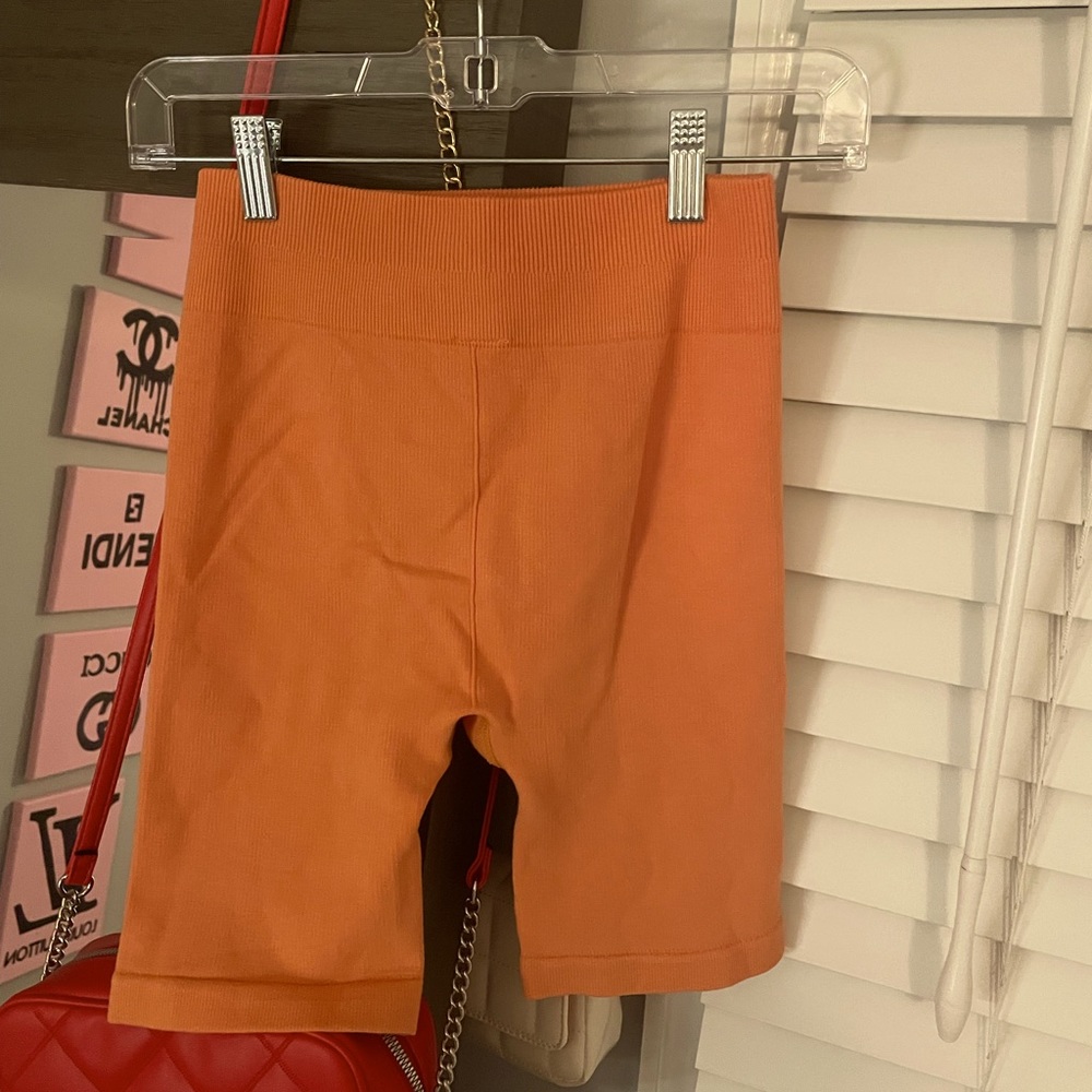 Fabletics Orange Biker Shorts. Size Small